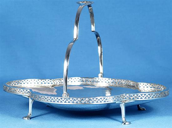A George V Arts & Crafts silver shallow basket, by Albert Edward Jones, width 277mm, weight 13oz/405grms.